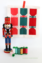 Load image into Gallery viewer, Add a festive pop to your holiday sewing with this playful Christmas Crackers quilt block! Beginner-friendly PDF pattern with full instructions. #ChristmasQuilt #QuiltBlockPattern