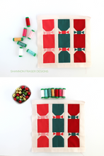 Load image into Gallery viewer, Looking for a quick and cute Christmas block to sew? This 12.5" cracker block pattern is fun, easy, and totally festive! #QuiltBlockLove #SewHandmadeHolidays