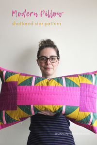 Shannon holding the Shattered star hand quilted lumber pillow | Shannon Fraser Designs #quilter