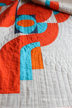Load image into Gallery viewer, Let your fabric flow with the Cloud Surfing Quilt—an abstract design full of movement and grace. Oval Drunkard’s Paths give this modern quilt a unique rhythm, perfect for playing with color gradients or solids. A bold yet calming statement piece. #ModernQuiltPattern #AbstractPatchwork #CloudSurfingQuiltDesign #CurvedPiecingQuilt #MinimalModernQuilting