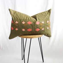 Load image into Gallery viewer, Decorative pillow with geometric pattern on a wooden stool against a white background