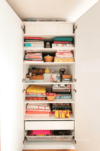 Load image into Gallery viewer, Closet with shelves filled with colorful fabric and accessories