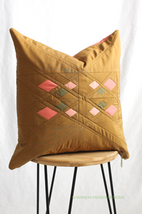 Ochre and coral square Guiding Lights Pillow | Modern quilt pattern by Shannon Fraser Designs