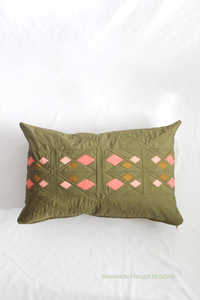 lumbar version of the Guiding Lights pillow. The modern quilt pattern includes instructions for an 18"x18" pillow and has step by step instructions on inserting a zipper.