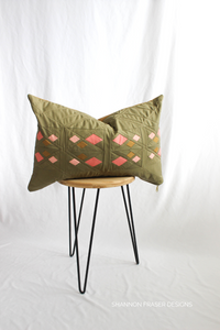 Moss green and coral lumbar Guiding Lights pillow by Shannon Fraser Designs #patchworkpillow 