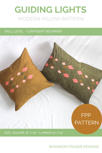 Guiding Lights Quilted Pillow Pattern by Shannon Fraser Designs includes instructions for both an18"x18" square pillow and 23"x15" lumbar pillow. The patchwork cushion uses FPP to achieve nice crisp points on the diamond motif. 