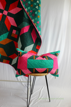 Load image into Gallery viewer, A modern quilted pillow pattern that looks bold but is easy to piece. The Shattered Star Lumbar Pillow is a quick, confident‑beginner project featuring HSTs and a simple zipper closure. Makers love the clear, detailed instructions—“Very detailed instructions, would recommend!” Create a cozy, textured pillow with just a couple of fat quarters and start stitching today.