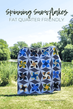 Load image into Gallery viewer, Just released! The Spinning Snowflakes quilt pattern is fat quarter friendly, and comes with coloring pages, cutting diagrams, pressing instructions, and block labels to keep you organized. Perfect for confident beginners and modern makers alike! #QuiltPatternDownload #BeginnerQuilt #QuiltingCommunity #DIYQuilt