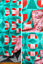 Load image into Gallery viewer, Spinning Snowflakes quilt pattern — bold blocks, four layouts, and half-rectangle triangle magic!