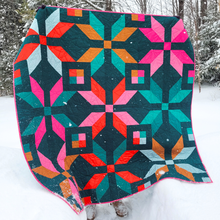 Load image into Gallery viewer, Winter Star quilt in the snowy winter wild.