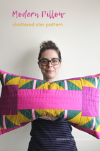 Load image into Gallery viewer, Shannon holding the Shattered star hand quilted lumber pillow | Shannon Fraser Designs #quilter