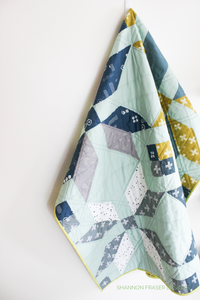 Winter Star Quilt Pattern by Shannon Fraser Designs - modern baby quilt featuring Heartland fabric collection from Art Gallery Fabrics. Grab a fat quarter bundle and make an heirloom quilt for your kids! #babyquilt #modernquilt #starquilt