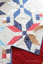 Load image into Gallery viewer, Winter Star Quilt Pattern by Shannon Fraser Designs featured here in Forest Talks fabric collection paired with Essex Linen. Machine and big stitch hand quilted for extra texture and detail. #modernquiltpattern #starquilt