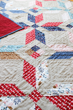 Load image into Gallery viewer, Winter Star Quilt Pattern by Shannon Fraser Designs - grab your favorite fat quarter bundle plus some background yardage and have fun piecing this beginner friendly star quilt. Add extra texture with both machine and hand quilting. #beginnerquiltpattern #fatquarterfriendly